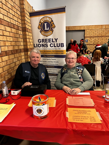 Lions Al (S) and Ellen greet arrivals at the Breakfast